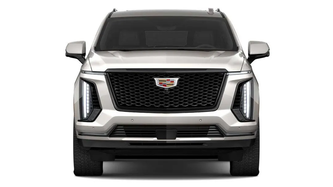 Front view of a 2027 Cadillac Escalade in the new Sandstone paint color on a white background